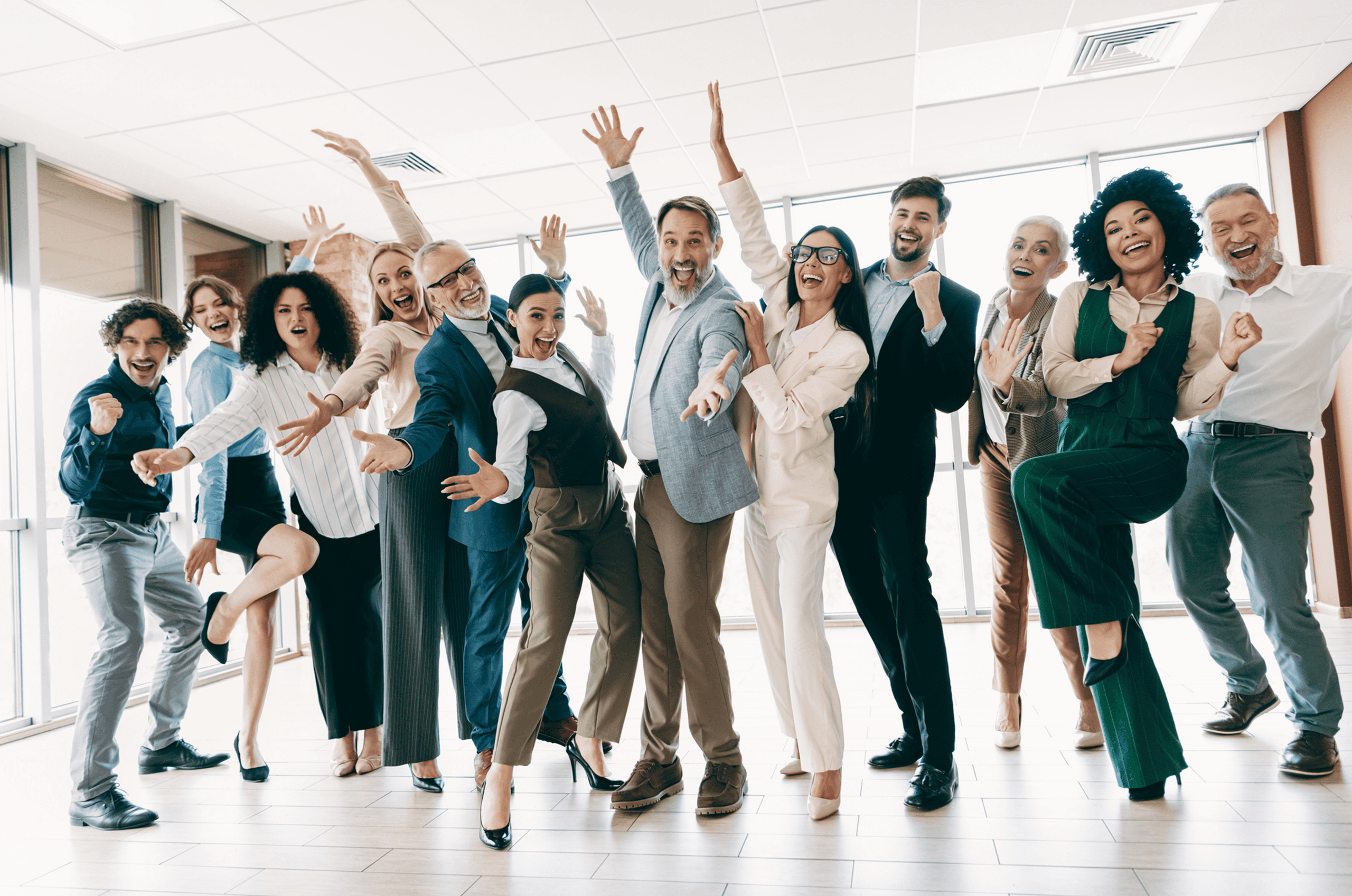 Cheerful group celebrating in an office.
