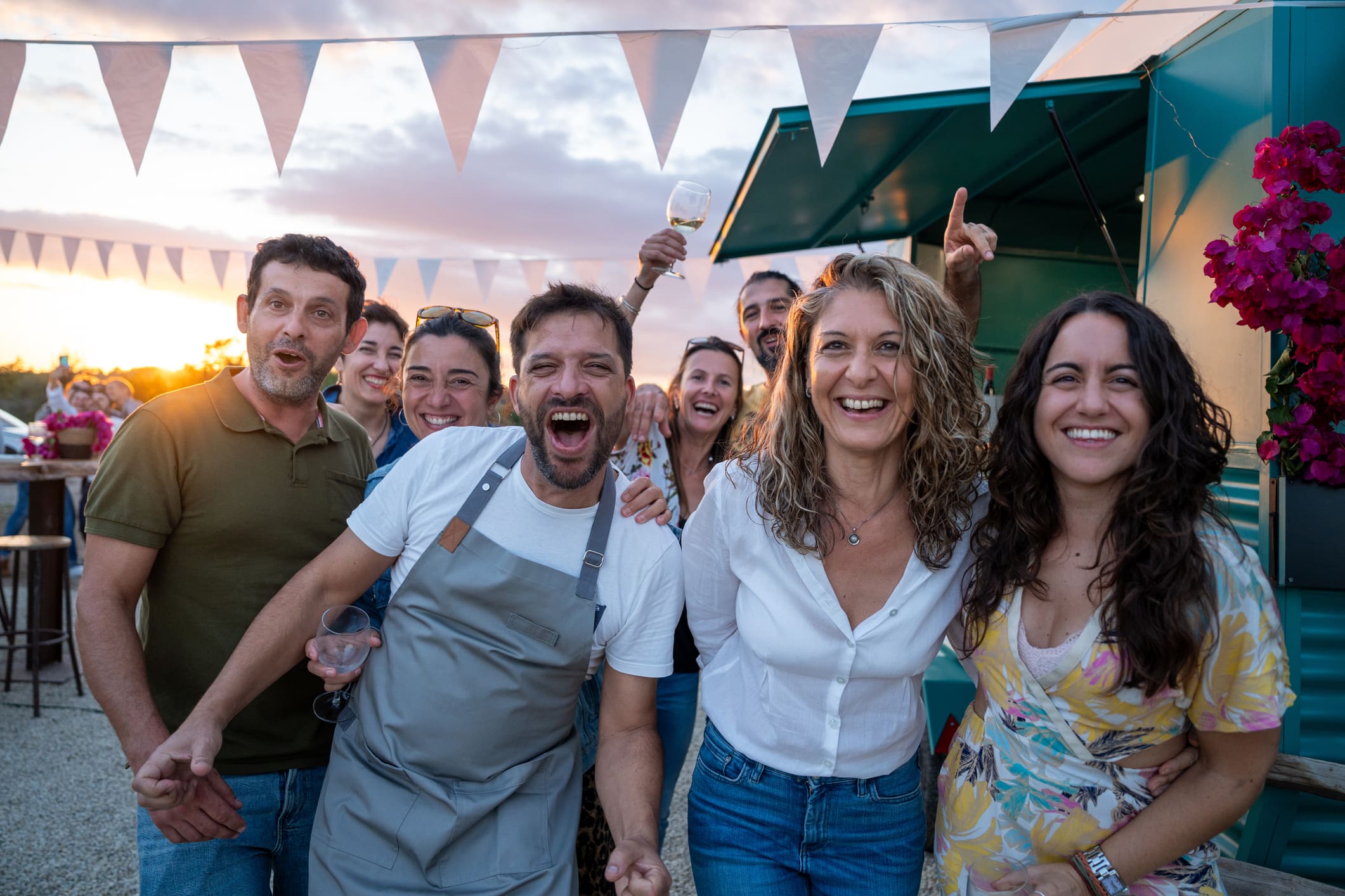 Group of friends celebrating at outdoor party.